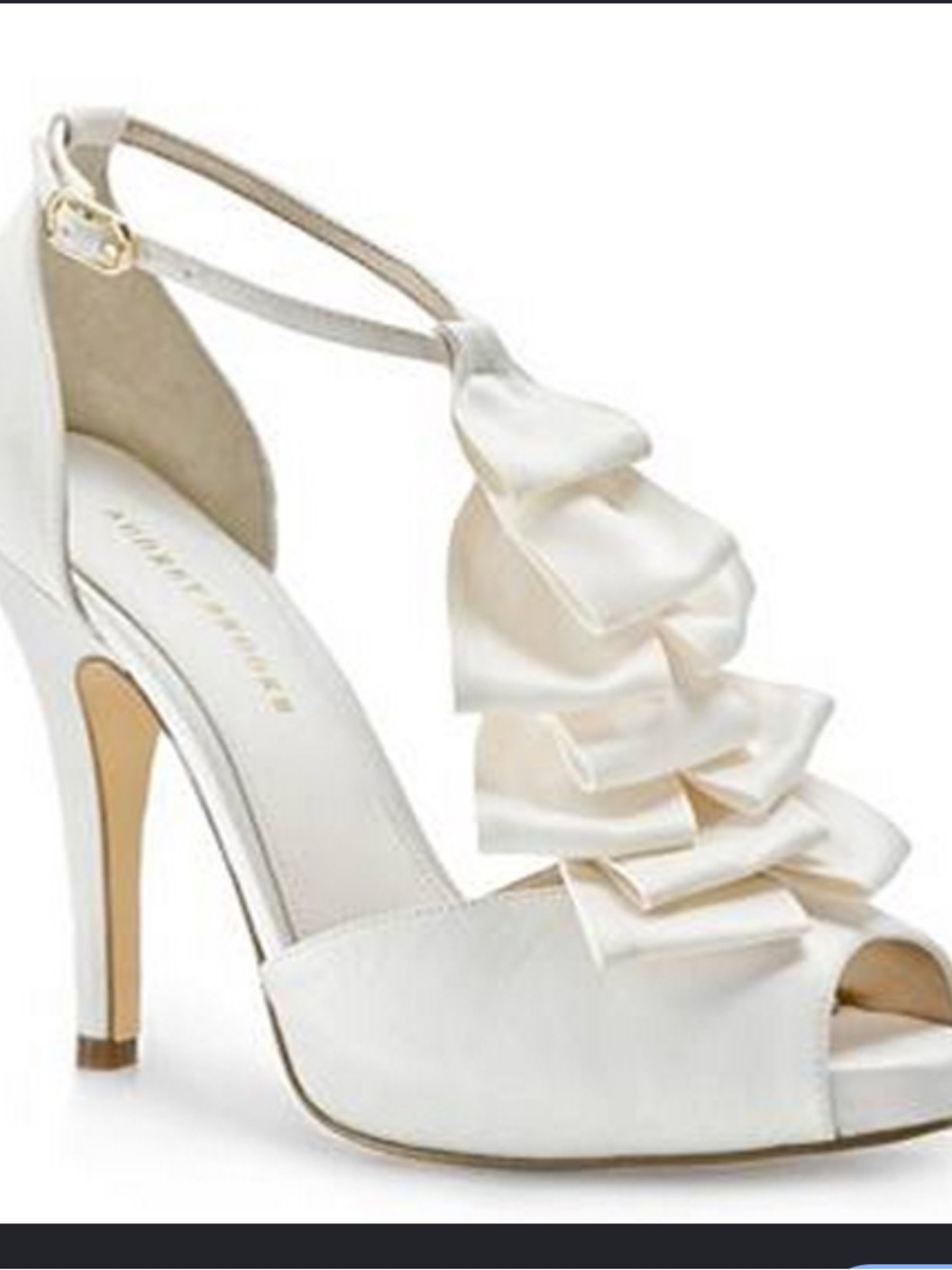 Audrey Brooke Estella Pump
With ruffles galore, this striking white pair of peep - Picture 2 of 8